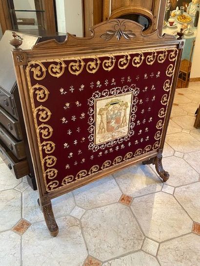 A carved molded natural wood mantel screen...