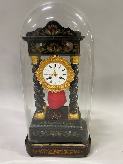 A portico clock in blackened wood
brass and...