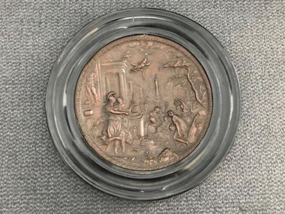 Copper medallion depicting the arts behind...
