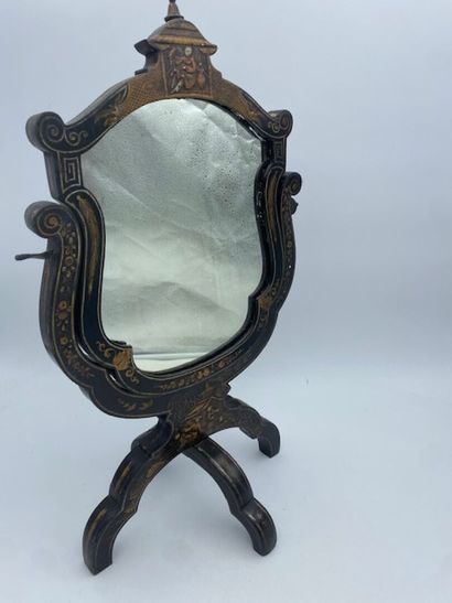 A dressing table mirror in lacquered wood...