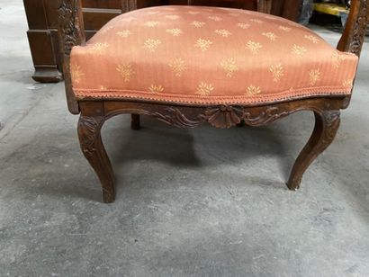 Armchair in molded natural wood, carved with...