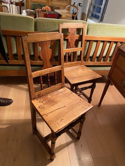 Two molded natural oak chairs with openwork...
