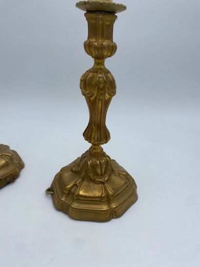 A pair of chased bronze torches 
decorated...