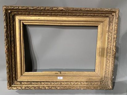 Gilded stuccoed wood frame decorated with...