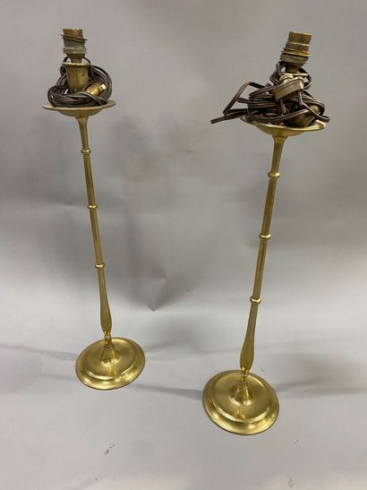 A pair of bronze torches decorated with balusters
English...