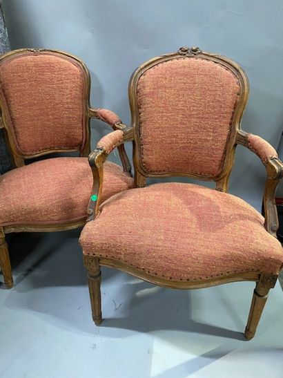 A pair of cabriolet armchairs in molded natural...