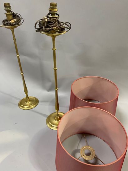 A pair of bronze torches decorated with balusters
English...