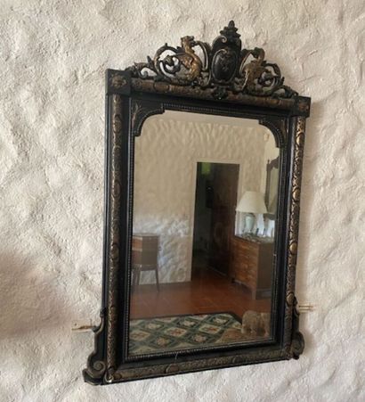 A black lacquered and gilded stuccoed wood...