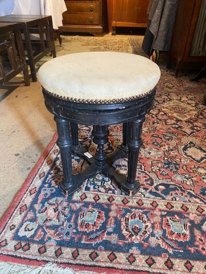 A blackened wood stool with column base -...