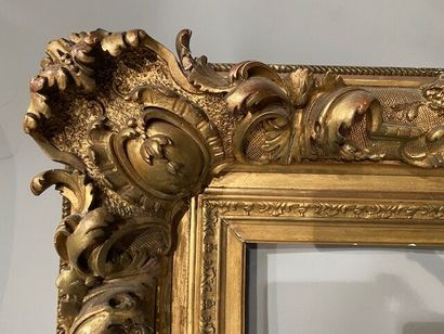 Gilded stuccoed wood frame decorated with...