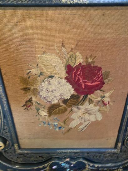 A blackened and gilded wood screen with vegetal...