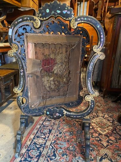 A blackened and gilded wood screen with vegetal...