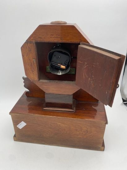 A rosewood and rosewood veneer clock with...