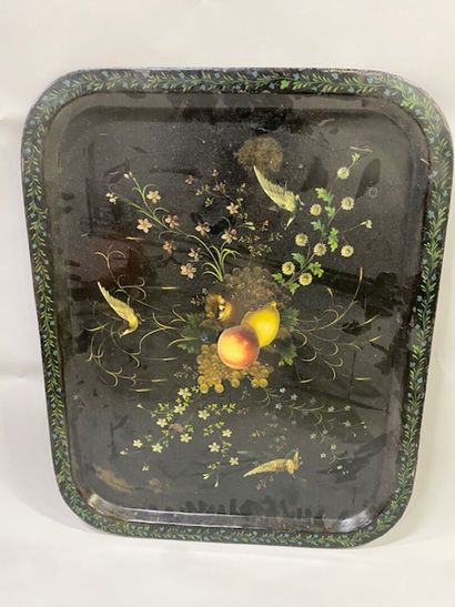 A black lacquered metal tray decorated with...