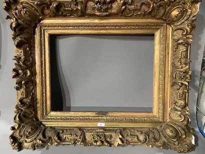 Gilded stuccoed wood frame decorated with...