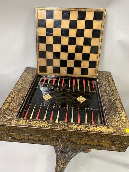 A Coromandel lacquer game table decorated...