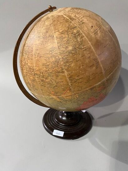A cardboard and paper globe on a bakelite...