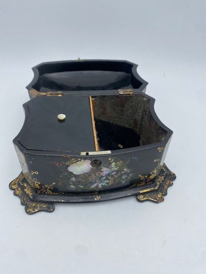 A lacquered wood tea chest with floral and...
