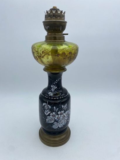 A kerosene lamp
In earthenware with a black...