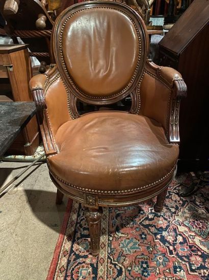 A mahogany and mahogany veneer swivel desk...