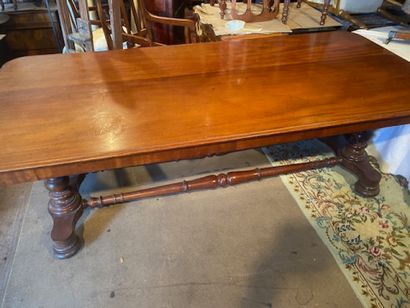 A mahogany and mahogany veneered dining table...