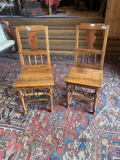 Two molded natural oak chairs with openwork...