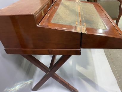 A mahogany and mahogany veneer travel desk
It...