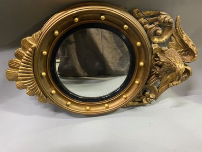 A witch mirror in stuccoed molded wood decorated...