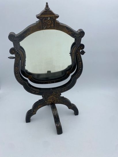 A dressing table mirror in lacquered wood...