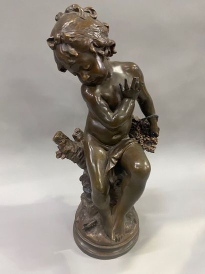 After Auguste MOREAU - A seated putto with...
