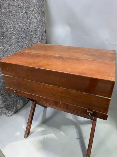 A mahogany and mahogany veneer travel desk
It...