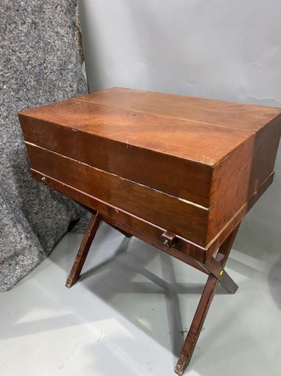 A mahogany and mahogany veneer travel desk
It...