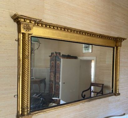 A gilded stuccoed wood mantel mirror with...