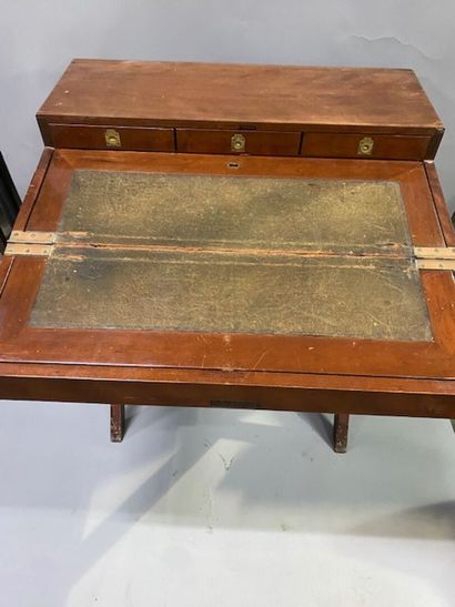 A mahogany and mahogany veneer travel desk
It...