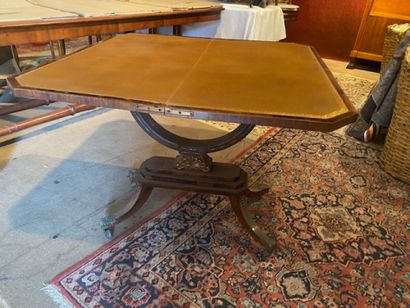 A mahogany and mahogany veneered dining table...