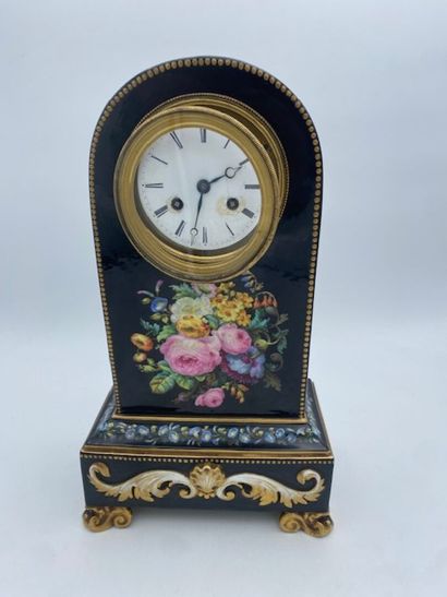 PARIS
A black porcelain clock decorated with...