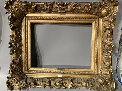 Gilded stuccoed wood frame decorated with...