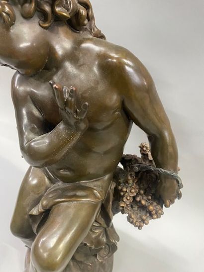 After Auguste MOREAU - A seated putto with...