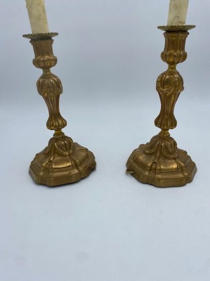A pair of chased bronze torches 
decorated...