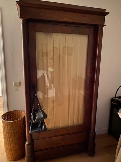 Mahogany veneered bookcase opening on one...