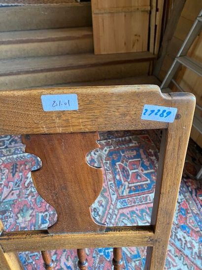 Two molded natural oak chairs with openwork...