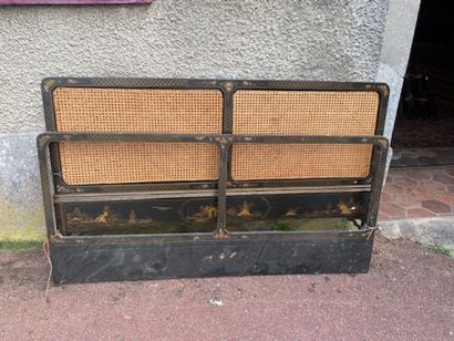 A bed bumper in blackened wood with polychrome...