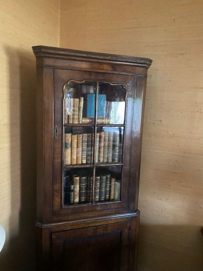A mahogany and mahogany veneered corner bookcase...