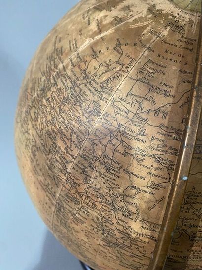 A cardboard and paper globe on a bakelite...