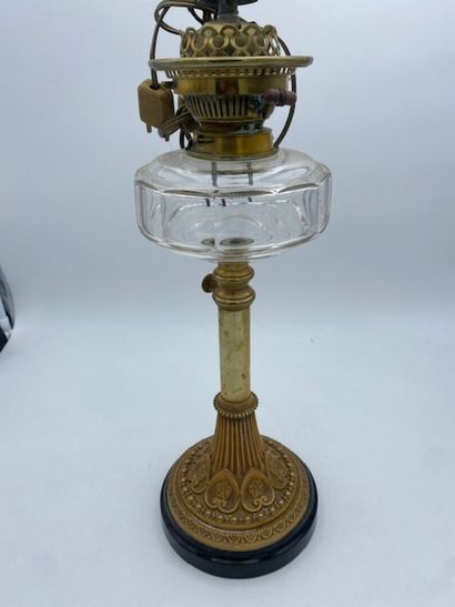 A bronze Corinthian column oil lamp topped...