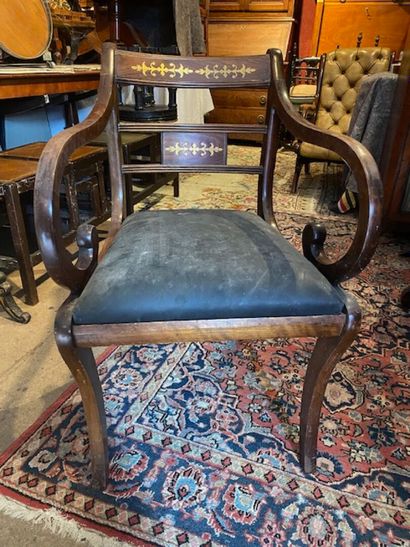 An armchair in mahogany and mahogany veneer...