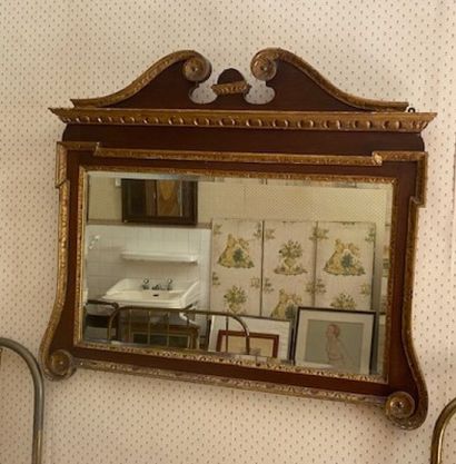 A black lacquered and gilded stuccoed wood...