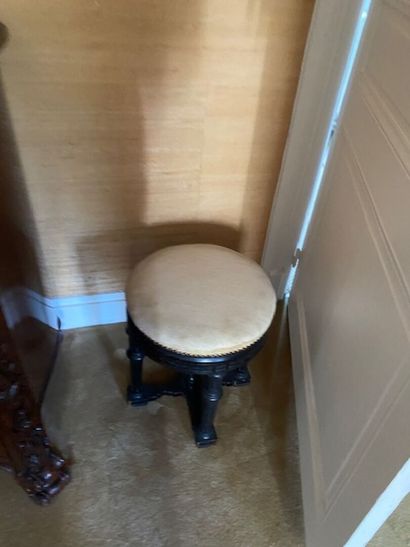 A blackened wood stool with column base -...