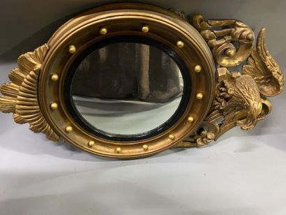 A witch mirror in stuccoed molded wood decorated...