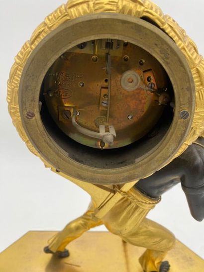 An ormolu and blackened clock decorated with...
